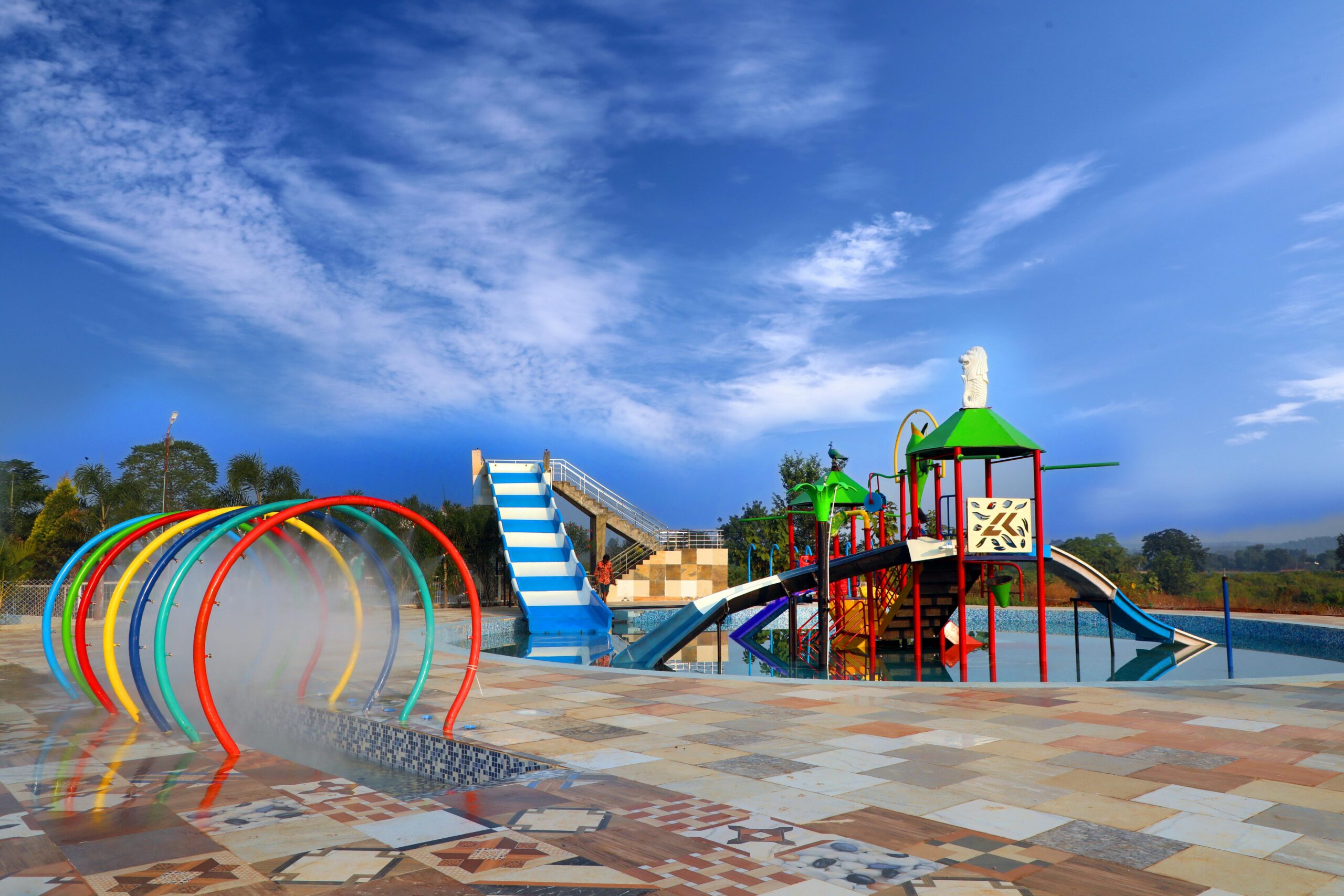 Vibrant water playground with slides and mist tunnels in Jabalpur, India.